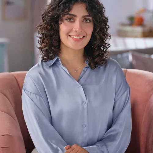 "3C curly wolf haircut with rounded layered shape, defined spiral curls, soft face-framing layers, and natural textured volume."